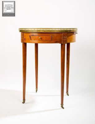 a small table with a marble top on it