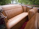 a brown leather couch in the back seat of a car