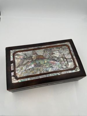 mother of pearl inlayed box with fish and fish on it