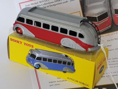 a toy bus that is sitting on top of a box
