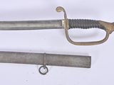two swords that are laying next to each other on a table