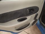 a car door with the door handle open and the door handle missing