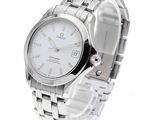 a close up of a watch on a white background