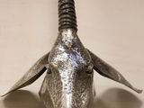an image of a metal goat head mounted on a wall