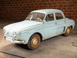 a old car that is sitting in a garage