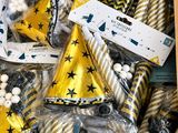 a box full of party hats and confetti cones