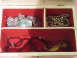 a box that has a bunch of jewelry inside of it