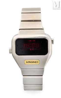 une montre numérique posée sur une surface blanche