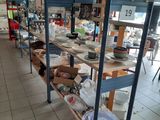 a room filled with lots of shelves with dishes on them