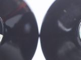 two black vinyl records with a green label on them