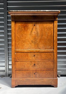 a wooden cabinet with a drawer on top of it