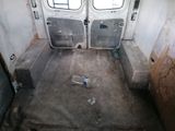 a photo of the inside of a van with the door open