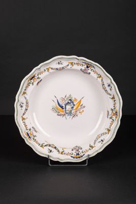 an image of a plate with a bird on it on a stand