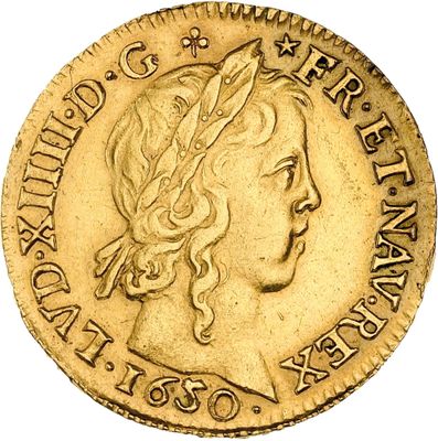a close up of a gold coin with a woman ' s head on it