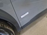 a car with a sticker on the side of it ' s door