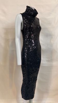 a black sequinned dress with a high neck and long sleeves