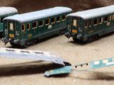 four toy trains that are sitting next to each other