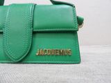 a green purse that has a name on it