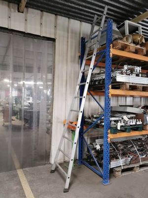 a large rack with many items in it in a warehouse