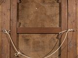 a picture of a wooden frame with a rope hanging from it