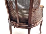 a chair that is made of wood and wicker