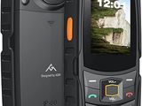 an image of a black cell phone with a picture of a mountain in the background