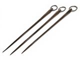 three pairs of metal knitting needles sitting on top of a white surface