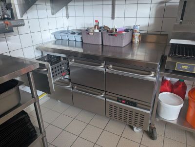 a large stainless steel kitchen with lots of counter space