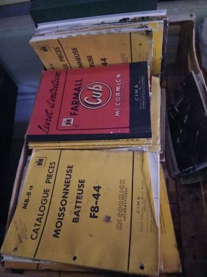 several books are stacked on top of each other on a table