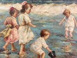 three children playing in the water at the beach