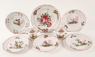 a group of plates and cups with flowers on them