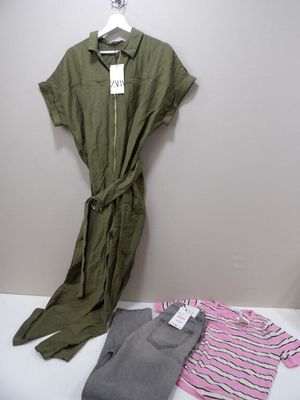 a green shirt and a pink and white striped shirt next to a pair of gray pants