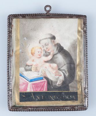an old picture of a man holding a baby in his lap