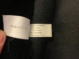 a label on a black shirt that says made in england
