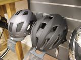three helmets that are hanging on the wall