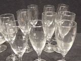 a lot of empty wine glasses on the table