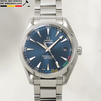an image of a close up of a wrist watch with a blue dial