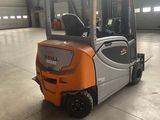 a forklift truck that is parked inside of a building