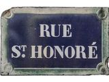 a blue sign that says rue st honore on it