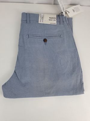 a close up of a pair of blue pants on a white surface