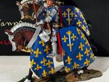 figurine of a knight on a horse holding a flag