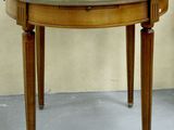 a small table with a mirror on top of it