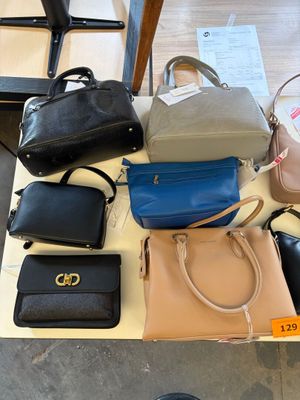 a lot of purses that are on the table