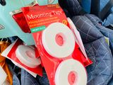 a bag of tape sitting on the back of a stroller