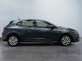 the blue car is parked in the garage on the concrete floor