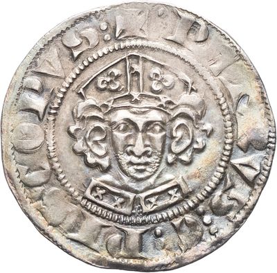 gros plan d'une pièce de monnaie surmontée d'une couronne