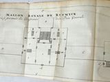 an old map of a town on a sheet of paper on a table