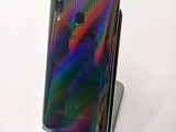 a close up of the back of a phone on a stand