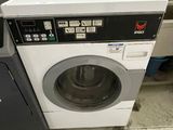 a washer and a dryer in a small room