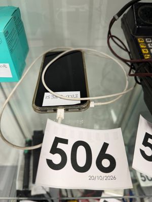 a lot of cell phones that are on display in a glass case